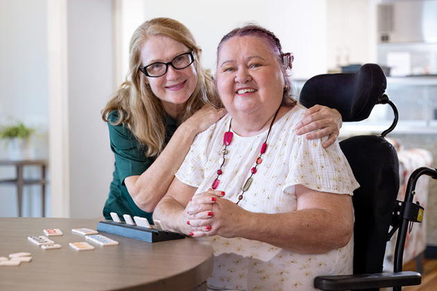 Staff and resident in a disability accommodation in Brisbane
