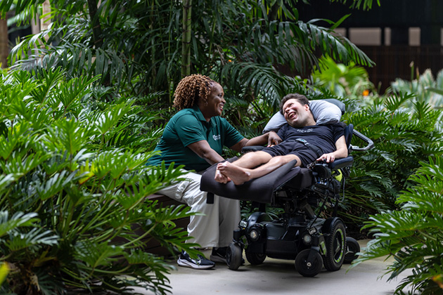 Staff and resident in a disability accommodation in Brisbane