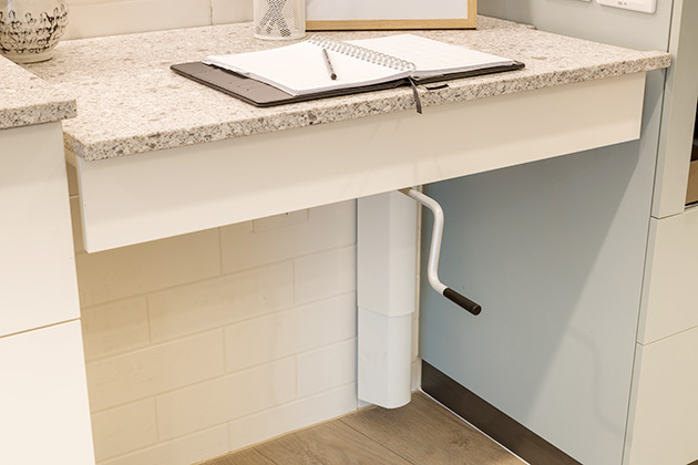 Adjustable handle under kitchen bench at disability accomodation in Murarrie, Brisbane
