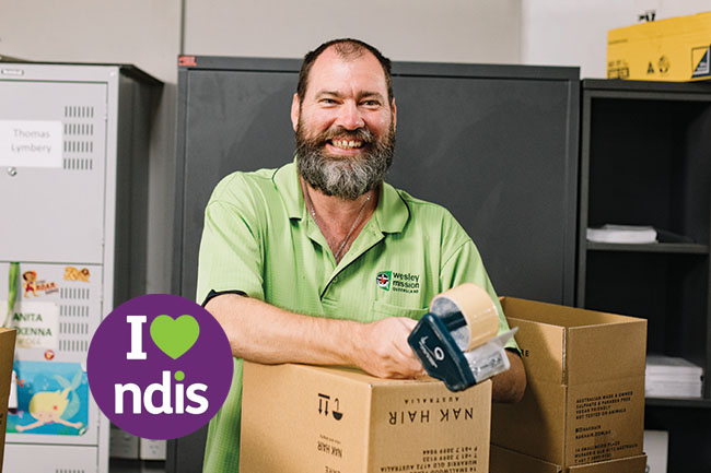 Staff packing at Wesley Industries NDIS Supported Employment