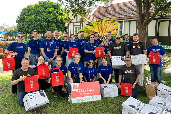 Mum and baby daughter at Hummingbird House entrance door