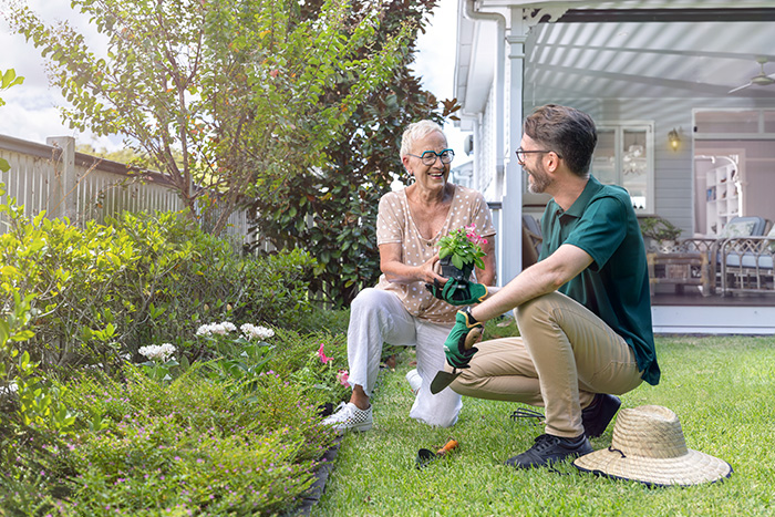 Home Care Brisbane - Staff and client gardening outdoors in a QLD home