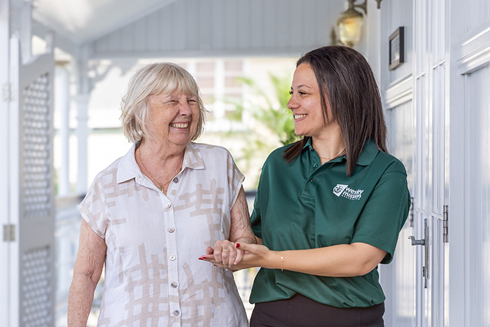 Home Care Brisbane - Staff and retiree chatting outdoors