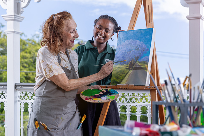 Home Care Brisbane - Staff and client painting outdoors