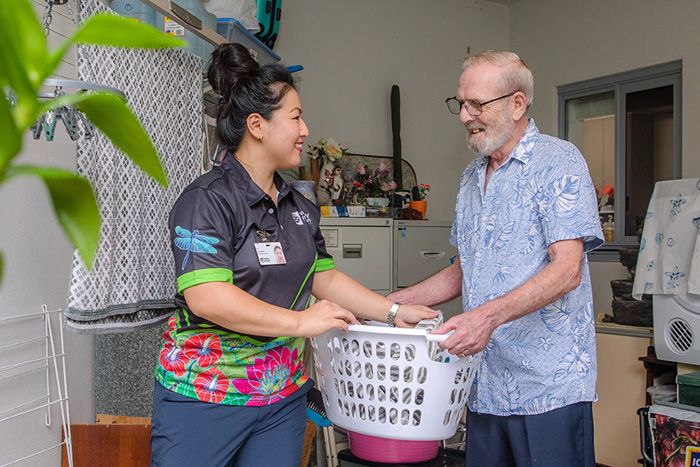 Home Care Brisbane - Staff helps with the laundry