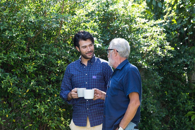 Aged care resident and volunteer talking in a park as part of the Volunteer Visitor scheme