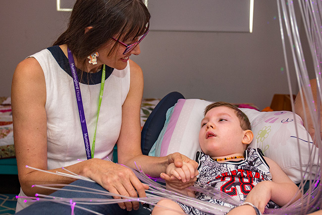 People filling Red Bags with groceries