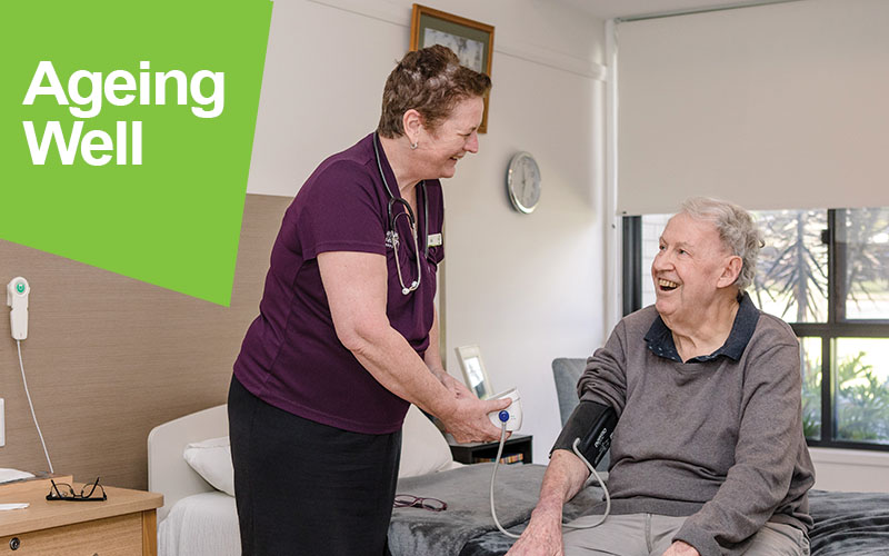Aged care worker with a resident in one of our residential aged care homes