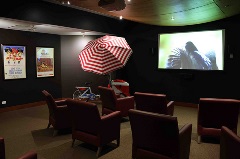 Cinema chairs facing screen with popcorn stand at Parkview Residential Aged Care Community in Brisbane North