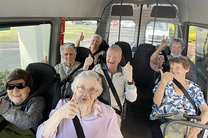 Respite care and residential aged care super happy in the bus