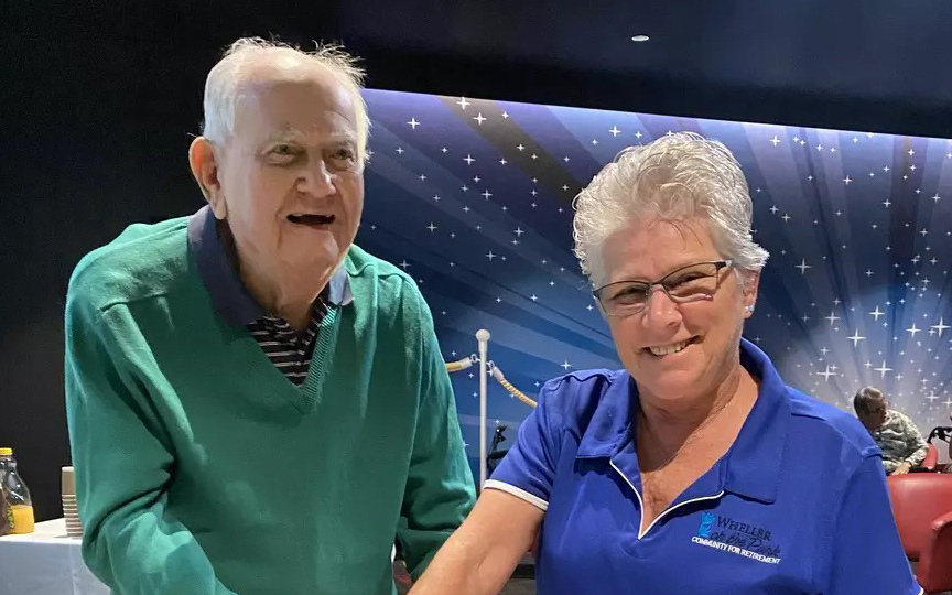 One of first residents of Wheller on The Park cuts the cake as residents celebrates 15 years at the retirement village in Chermside